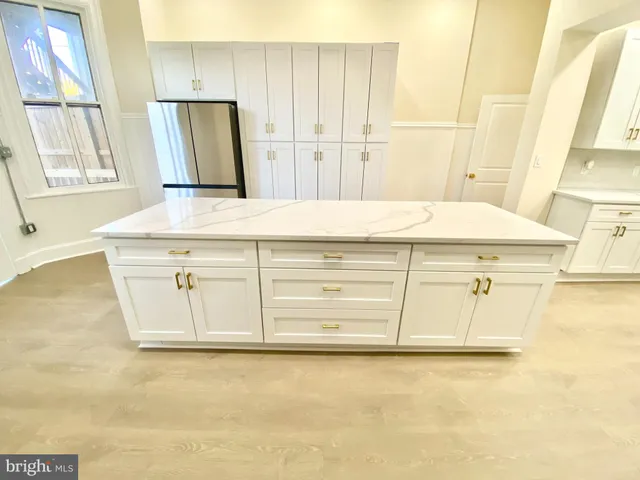 a bathroom with a sink a vanity and a mirror