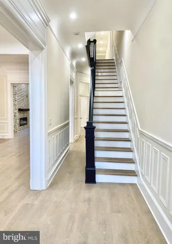 a view of a hallway with stairs