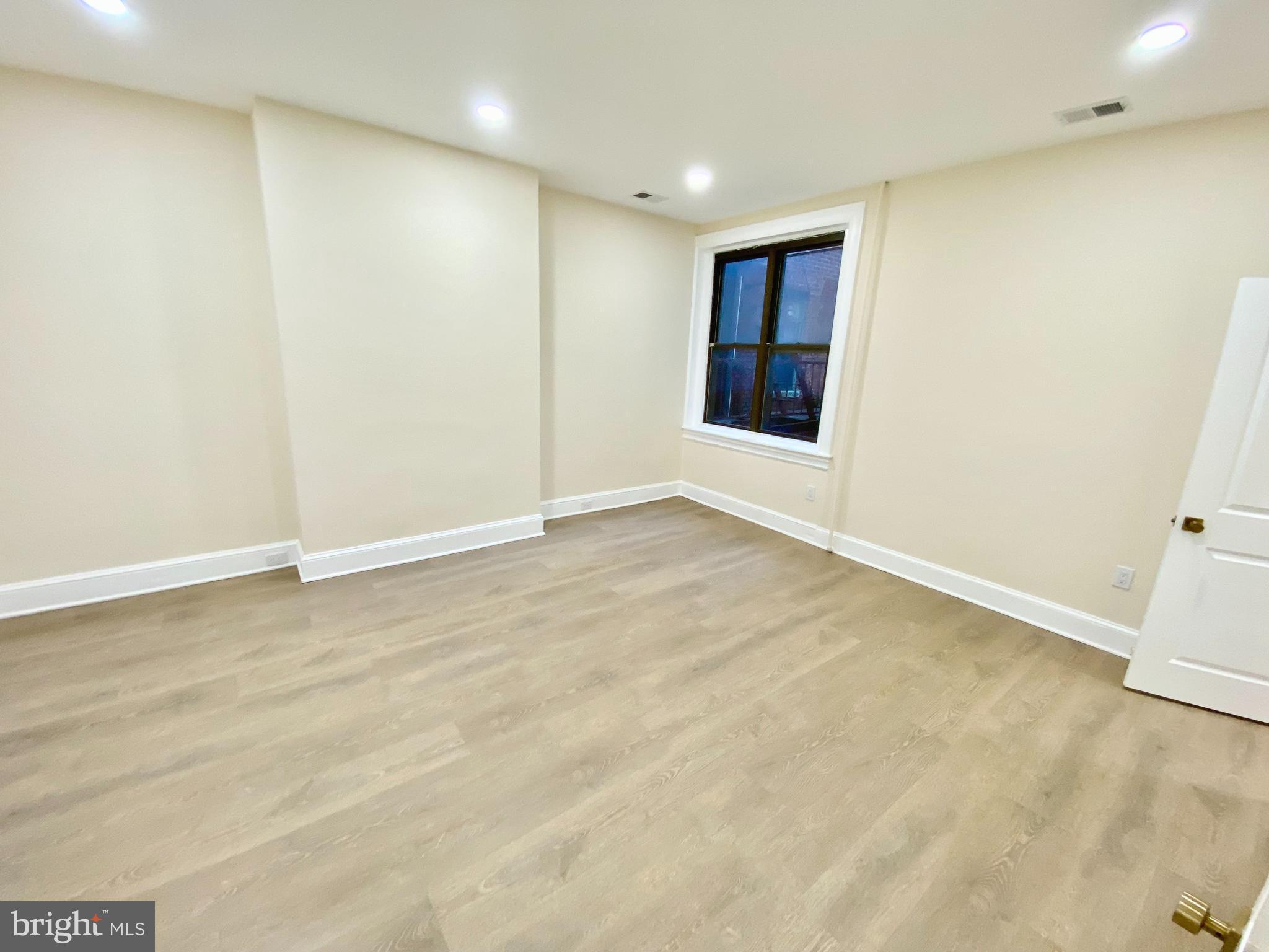 2428 Eutaw Place Baltimore, MD 21217 - Photo 21 of 48 an empty room with a natural light