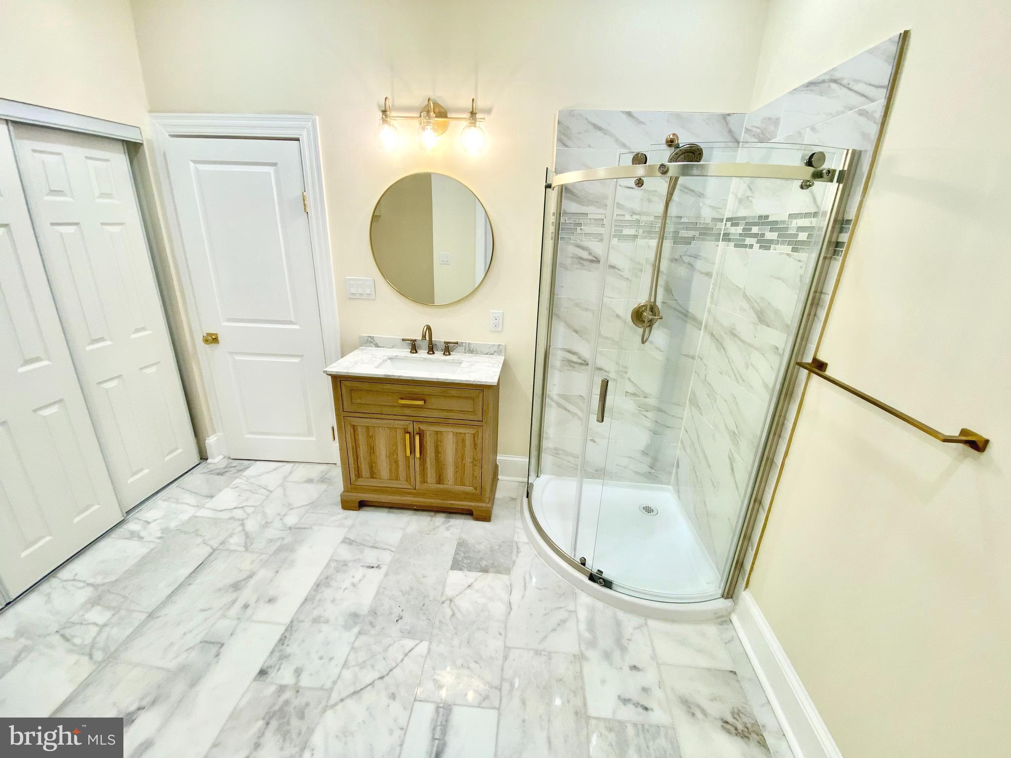 2428 Eutaw Place Baltimore, MD 21217 - Photo 26 of 48 a bathroom with a sink mirror toilet and shower