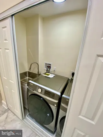 a view of a hallway with staircase