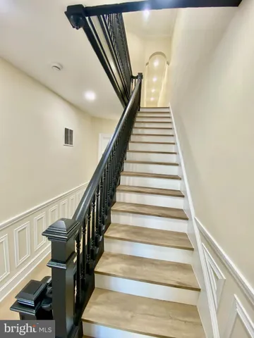 an entryway in a room with a mirror