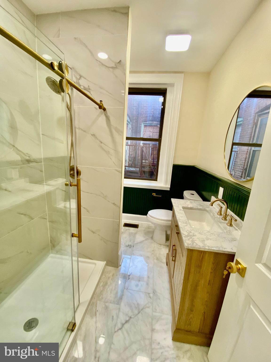 2428 Eutaw Place Baltimore, MD 21217 - Photo 34 of 48 a bathroom with a tub sink and shower