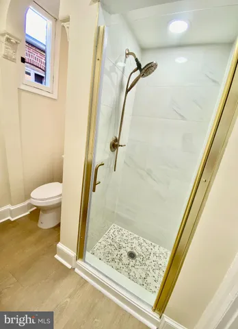 a bathroom with a sink mirror and vanity