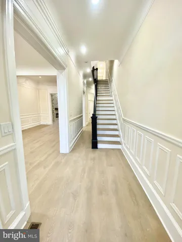 a view of a hallway with staircase