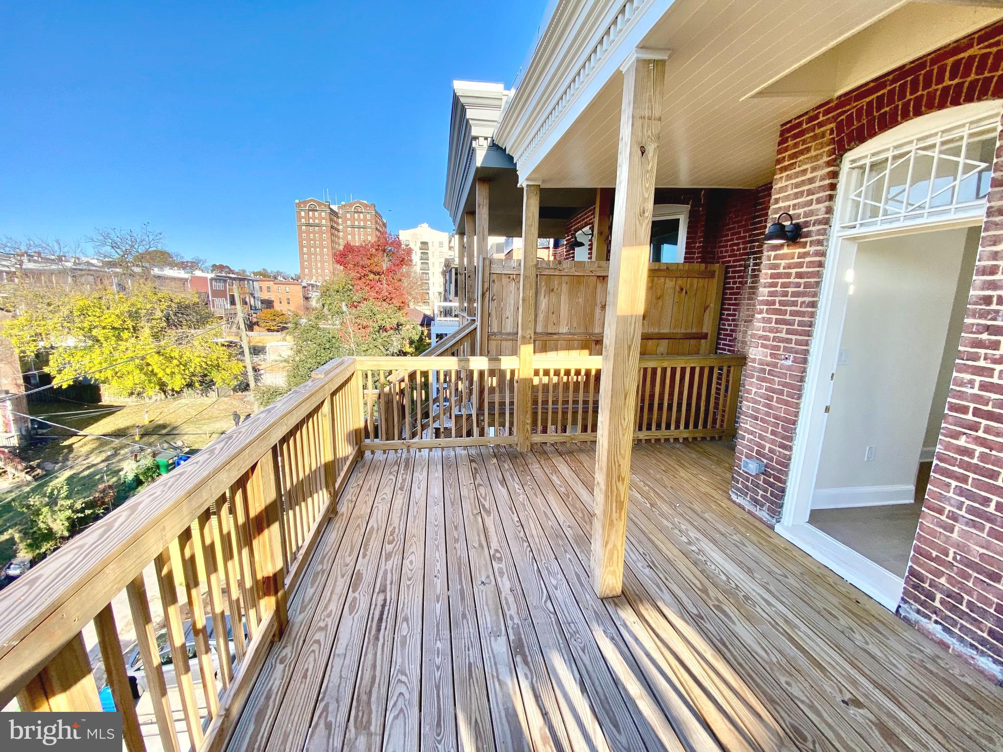 2428 Eutaw Place Baltimore, MD 21217 - Photo 41 of 48 a view of a balcony with wooden floor