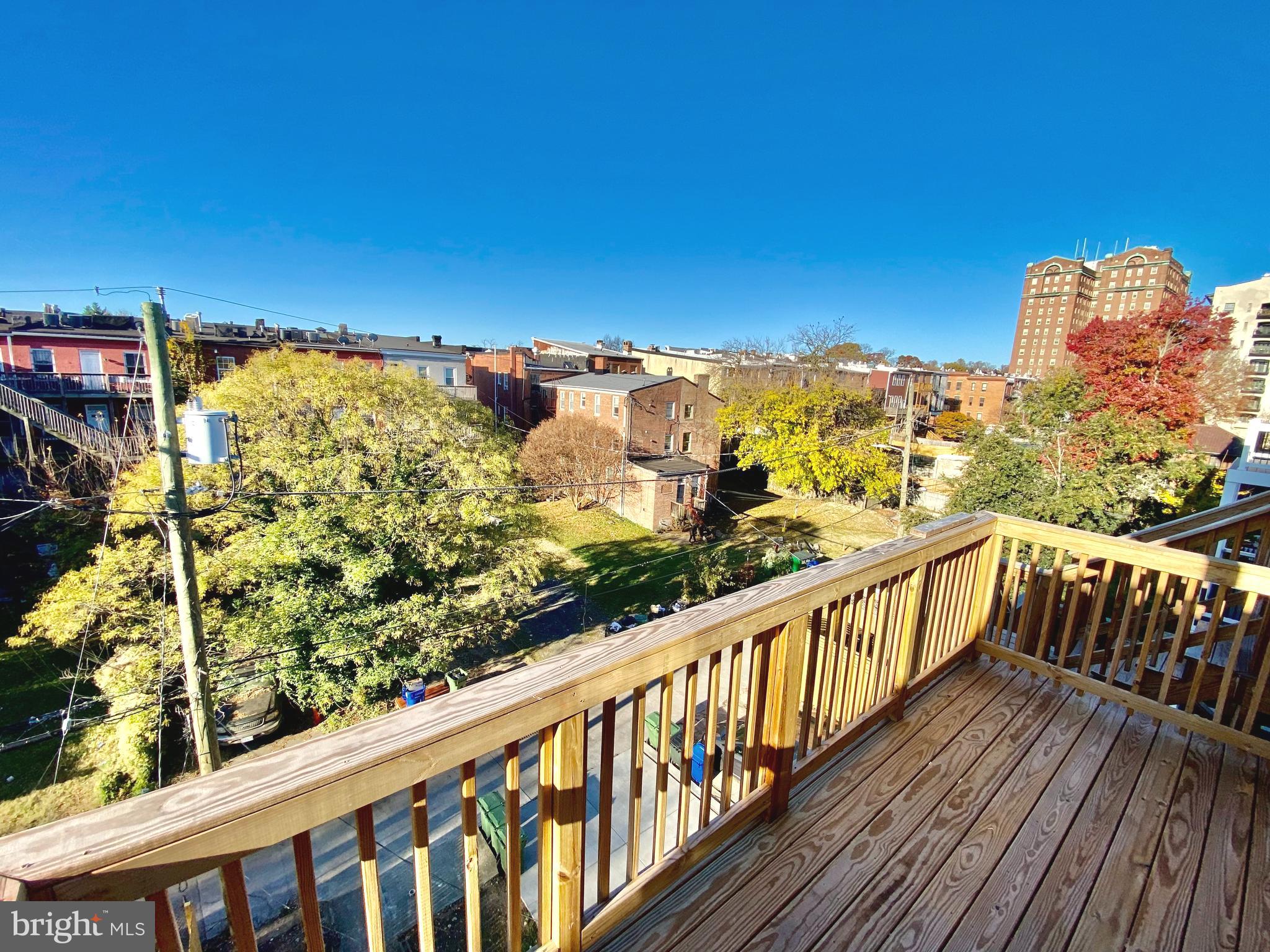 2428 Eutaw Place Baltimore, MD 21217 - Photo 42 of 48 a view of a balcony with wooden floor and city view