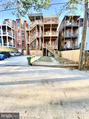a view of a building with a street