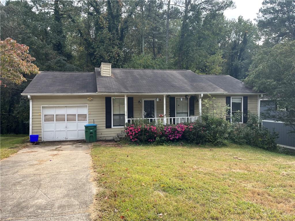 3788 Ferncliff Road Southwest Snellville, GA 30039 - Photo 1 of 1 a view of a house with table and chairs in a patio