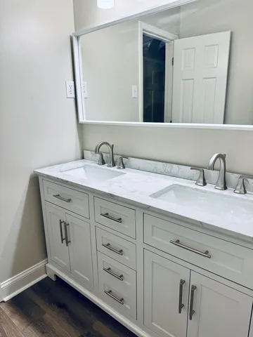 a bathroom with a sink and a mirror