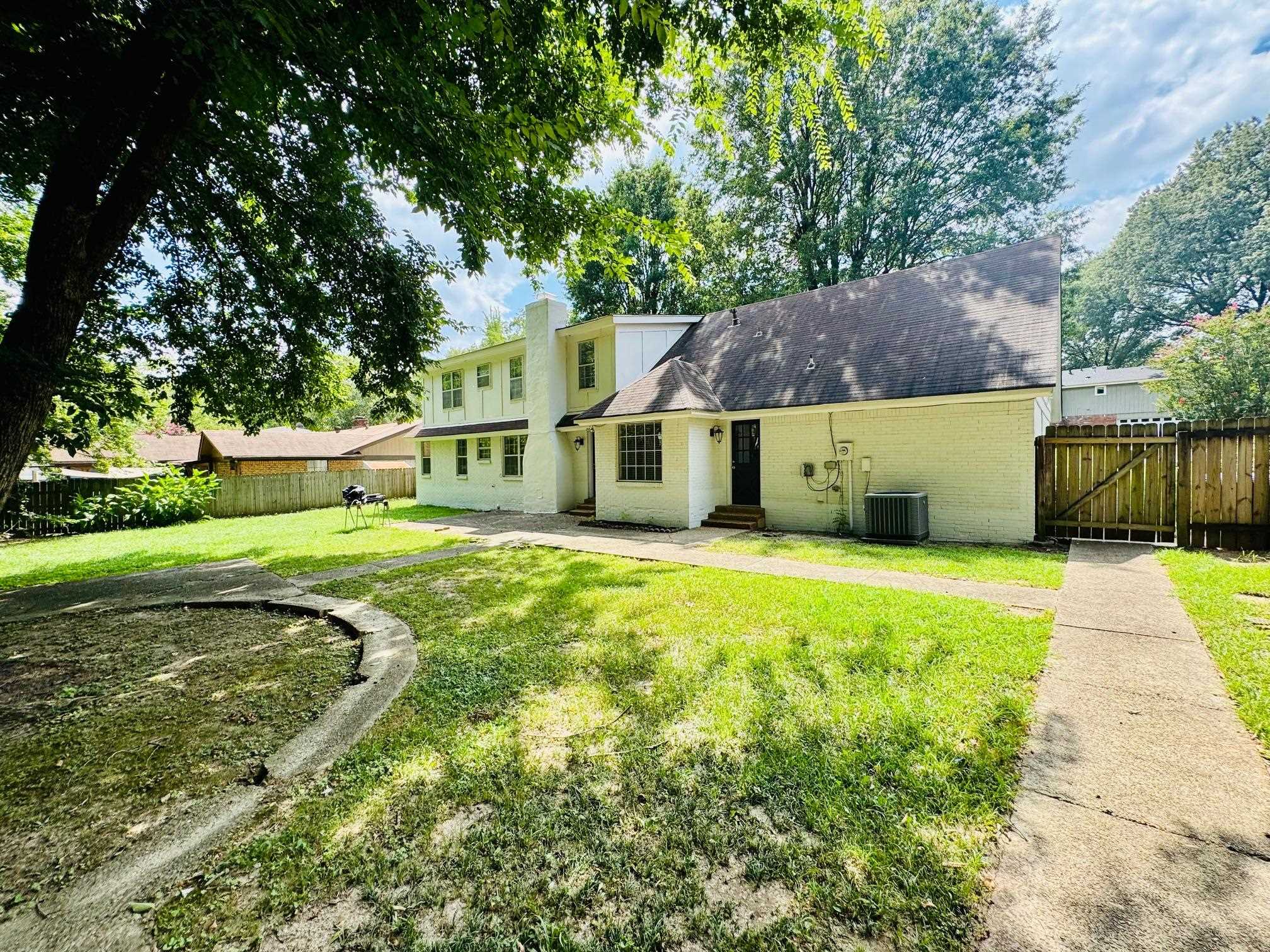 2212 Howard Road Germantown, TN 38138 - Photo 20 of 24 a view of a house with a yard