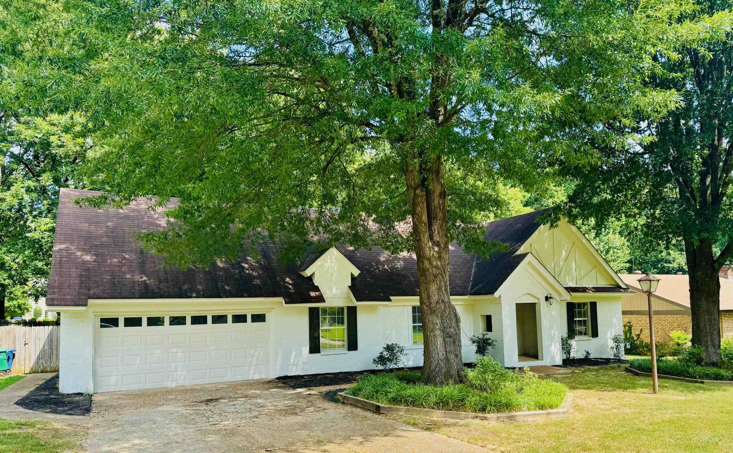 2212 Howard Road Germantown, TN 38138 - Photo 2 of 24 a front view of a house with garden