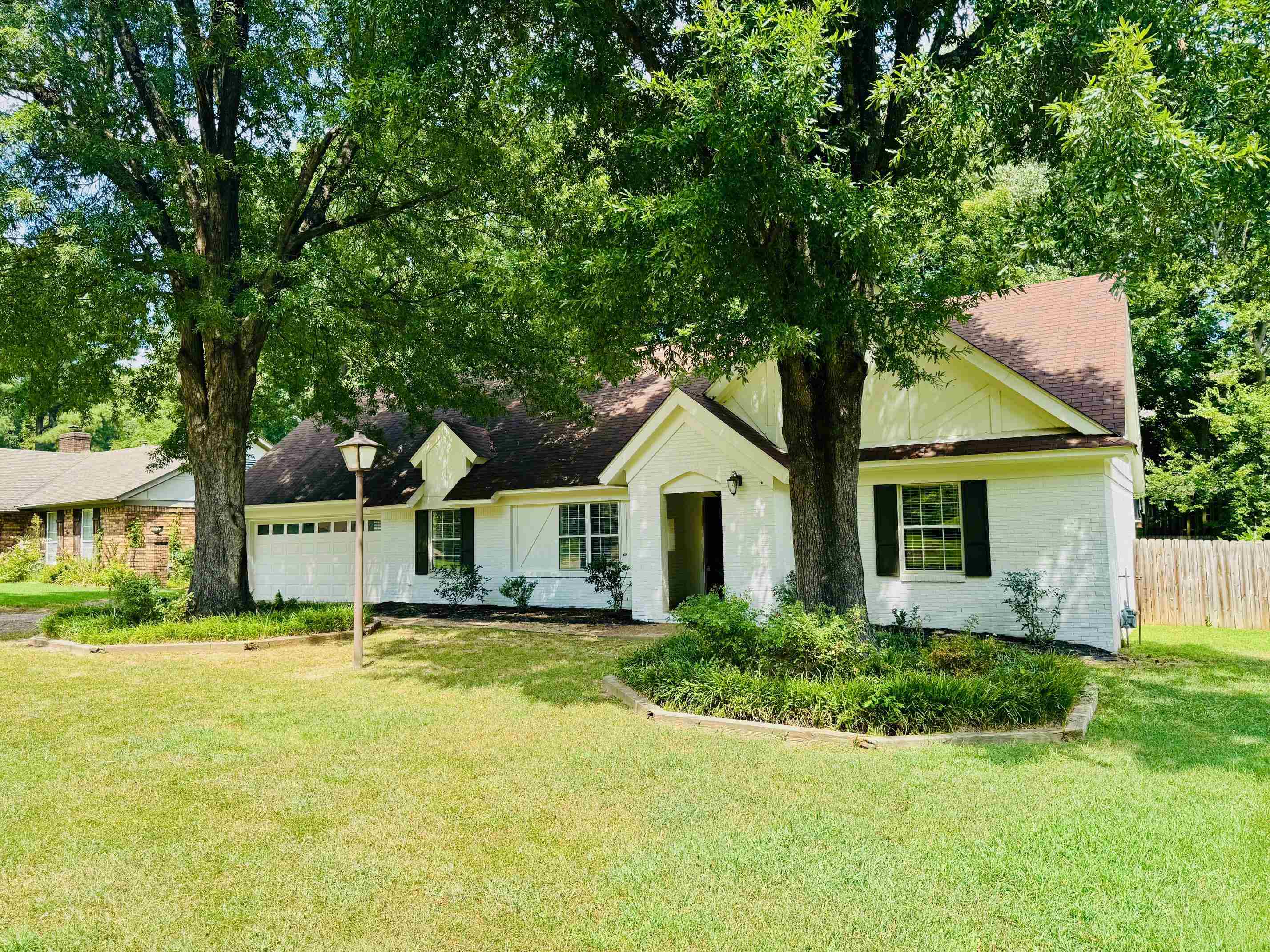 2212 Howard Road Germantown, TN 38138 - Photo 5 of 24 a front view of house with yard and green space