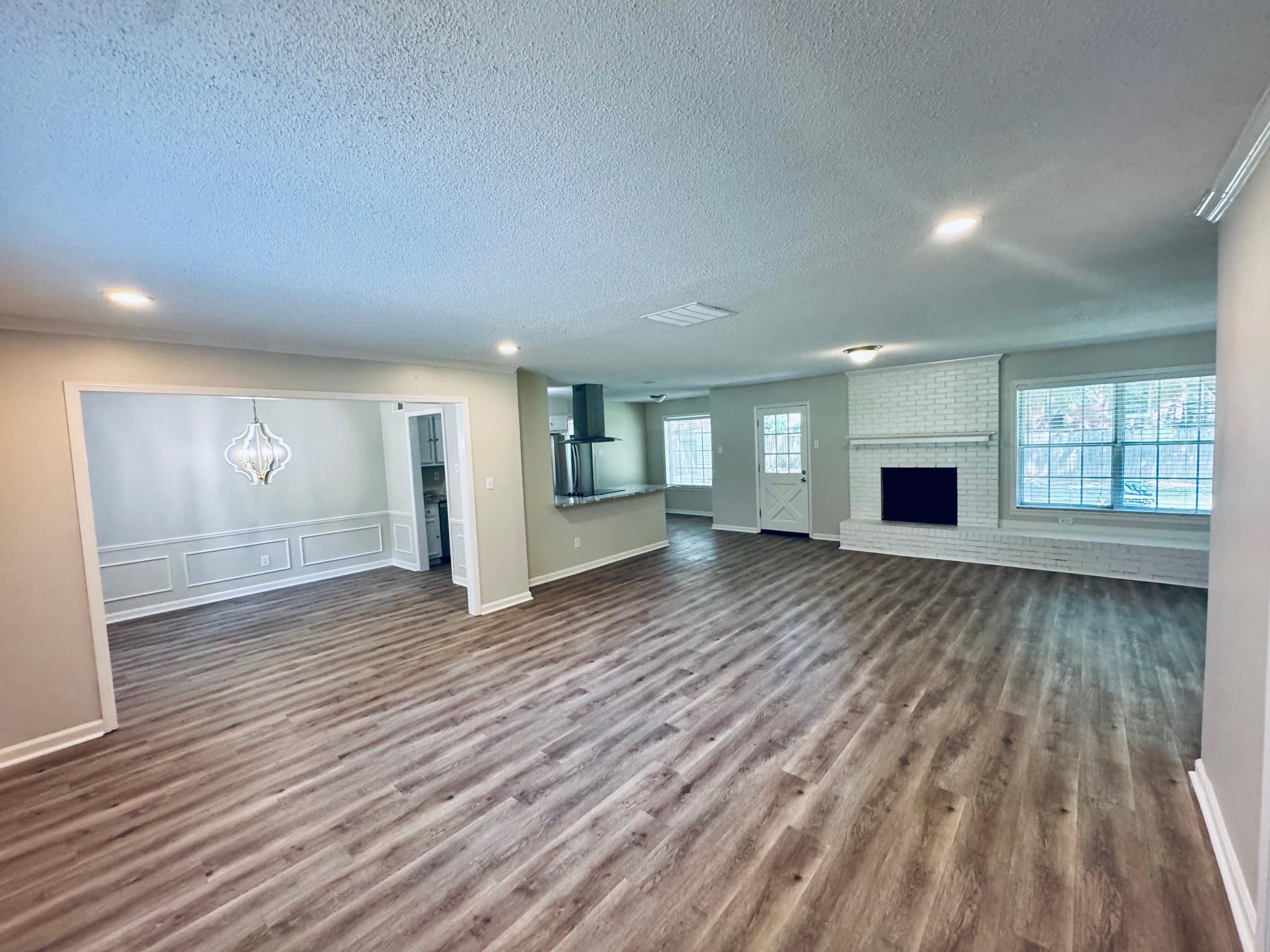 2212 Howard Road Germantown, TN 38138 - Photo 10 of 24 a view of a room with wooden floor and window