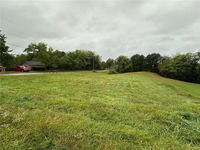 a view of a field with an outdoor space