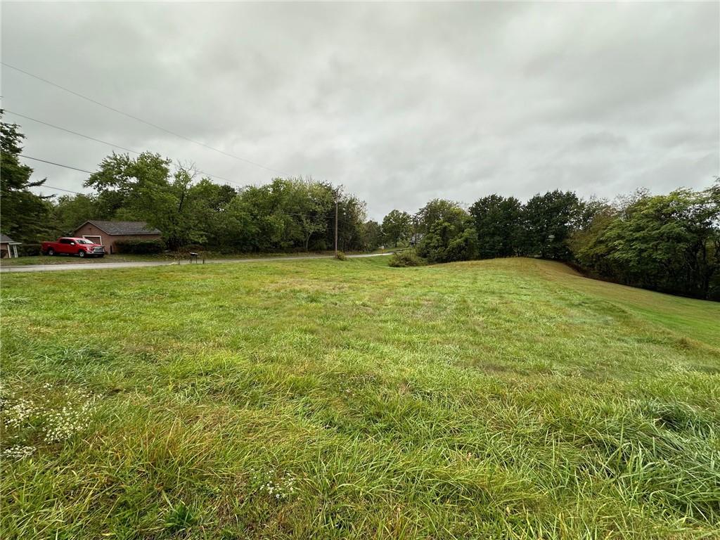 a view of a field with an outdoor space