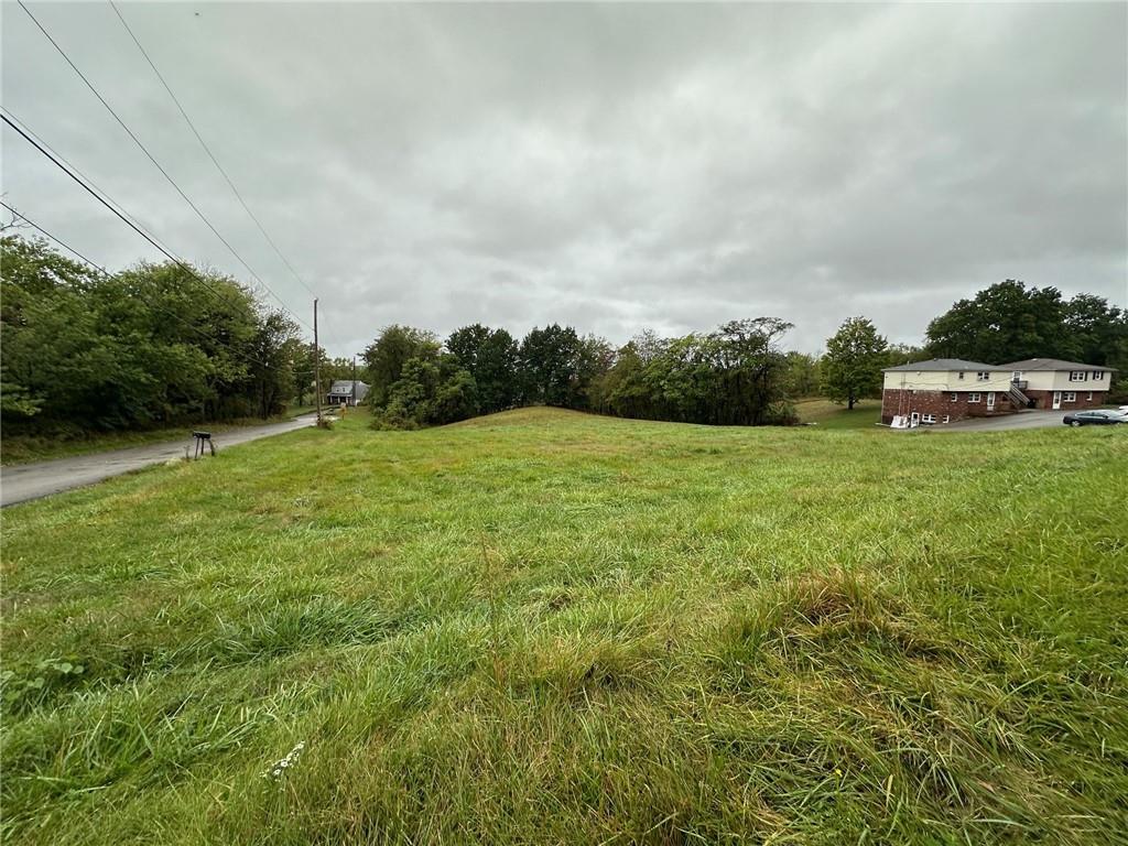 0 Temple Road Monaca, PA 15061 - Photo 3 of 14 a view of a green field with wooden fence