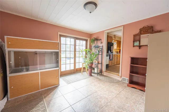 a view of an empty room with a window