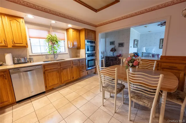 a dining room with furniture a window and kitchen view