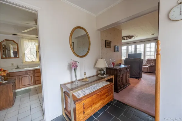 a living room with furniture a table and chairs