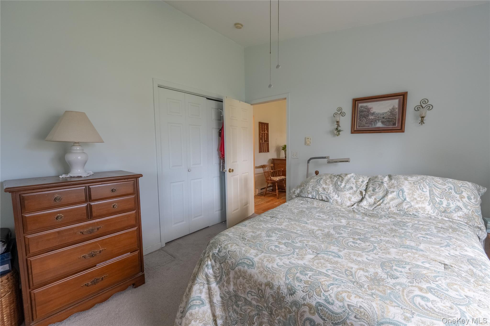 5028-5030 Rt-82 Millbrook, NY 12578 - Photo 49 of 50 a bedroom with a bed and a lamp on dresser