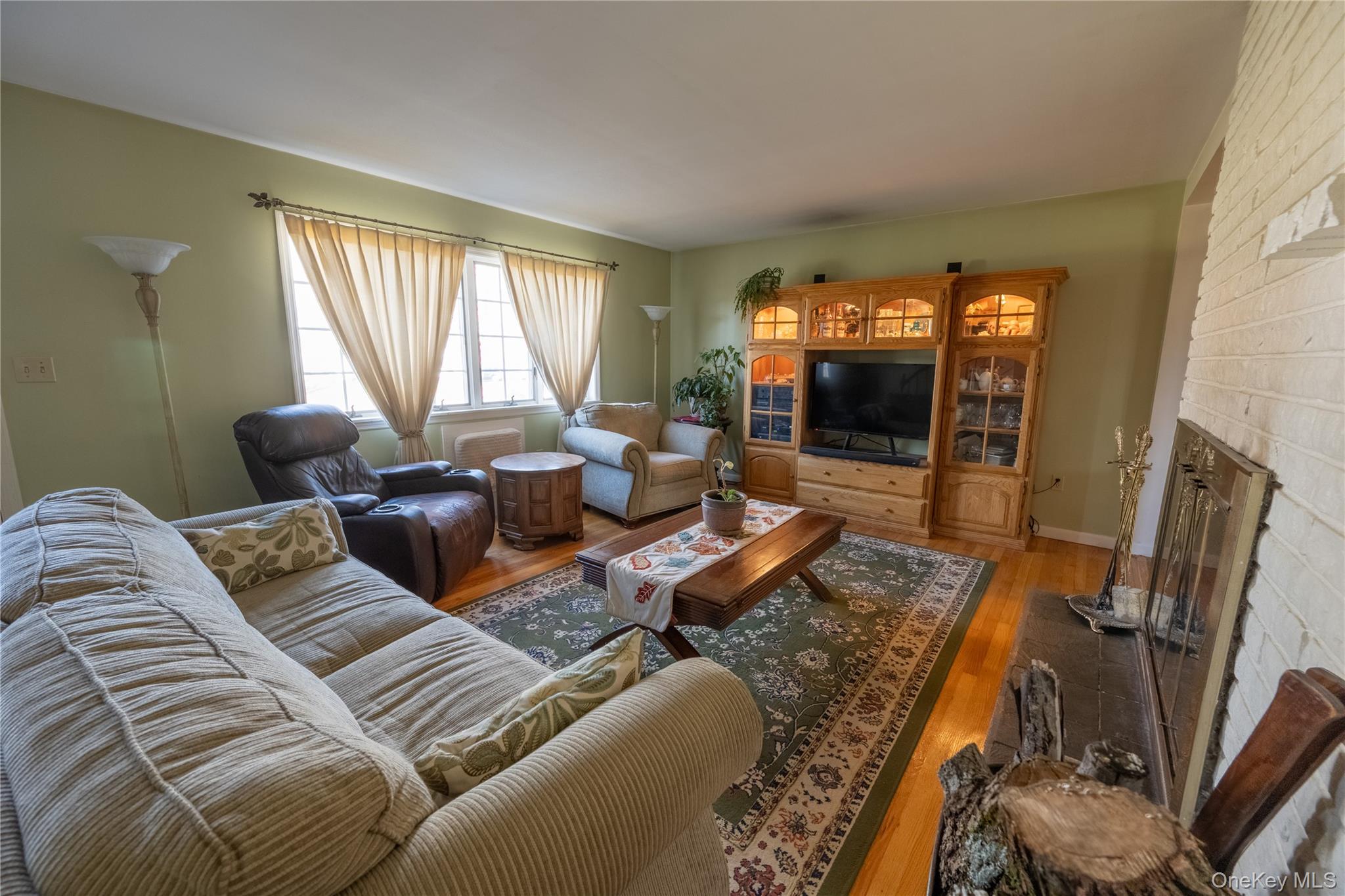 5028-5030 Rt-82 Millbrook, NY 12578 - Photo 8 of 50 a living room with furniture a large window and a flat screen tv