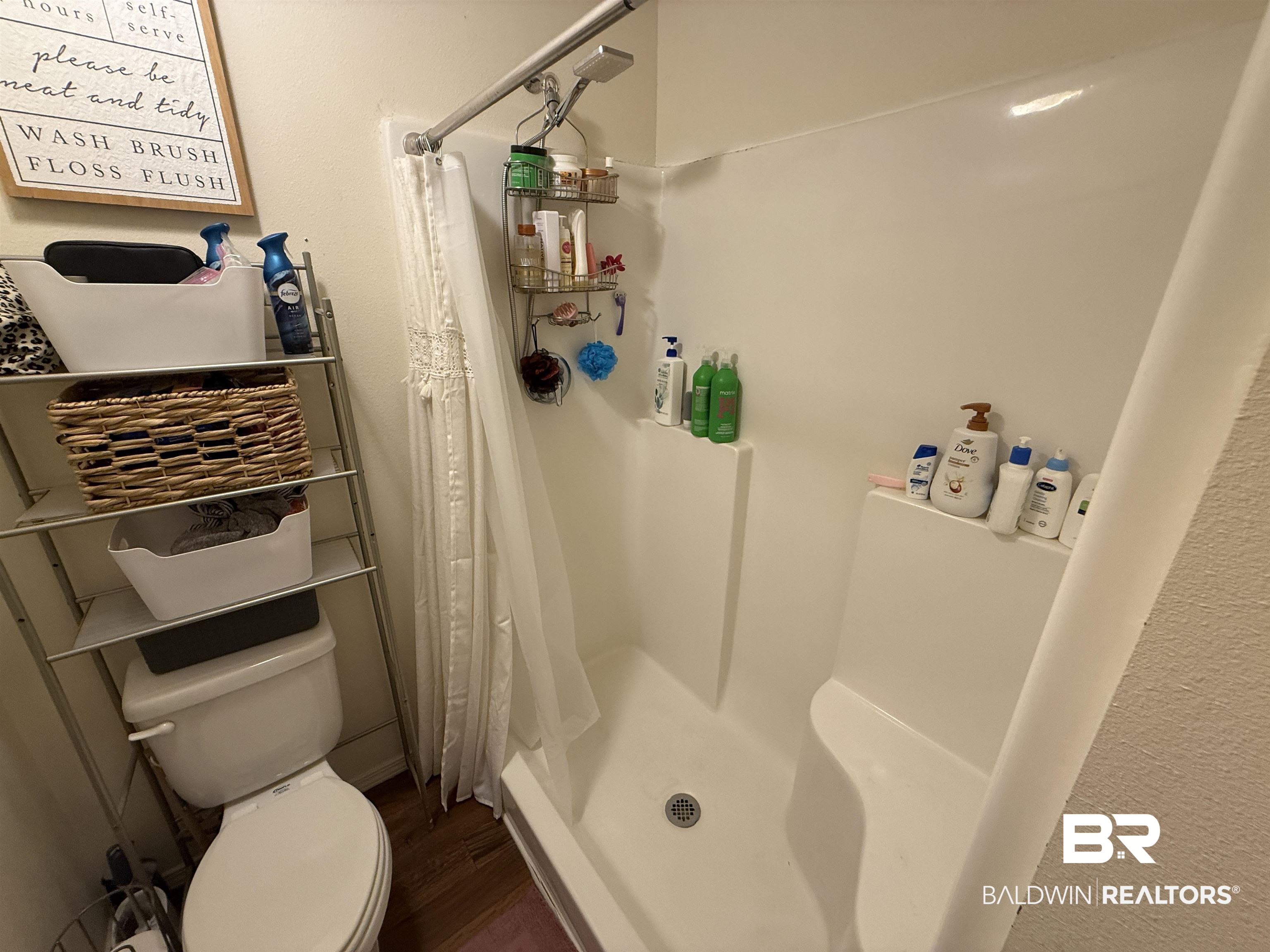 820 Fannie Road Century, FL 32535 - Photo 20 of 29 Full bathroom featuring a shower stall and wood finished floors
