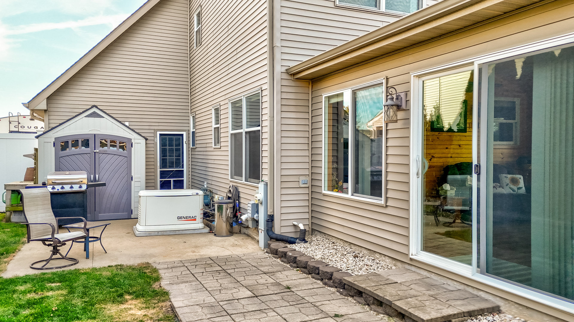 844 Kimberly Lane Ottawa, IL 61350 - Photo 32 of 36 a view of a patio with a table and chairs and floor to ceiling window
