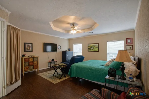 a bedroom with furniture and a window