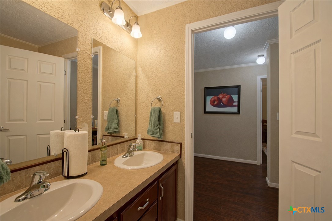 73 Rose Way North Victoria, TX 77905 - Photo 27 of 44 a bathroom with a double vanity sink and a mirror