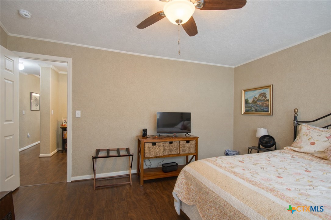 73 Rose Way North Victoria, TX 77905 - Photo 30 of 44 a bedroom with a bed and wooden floor