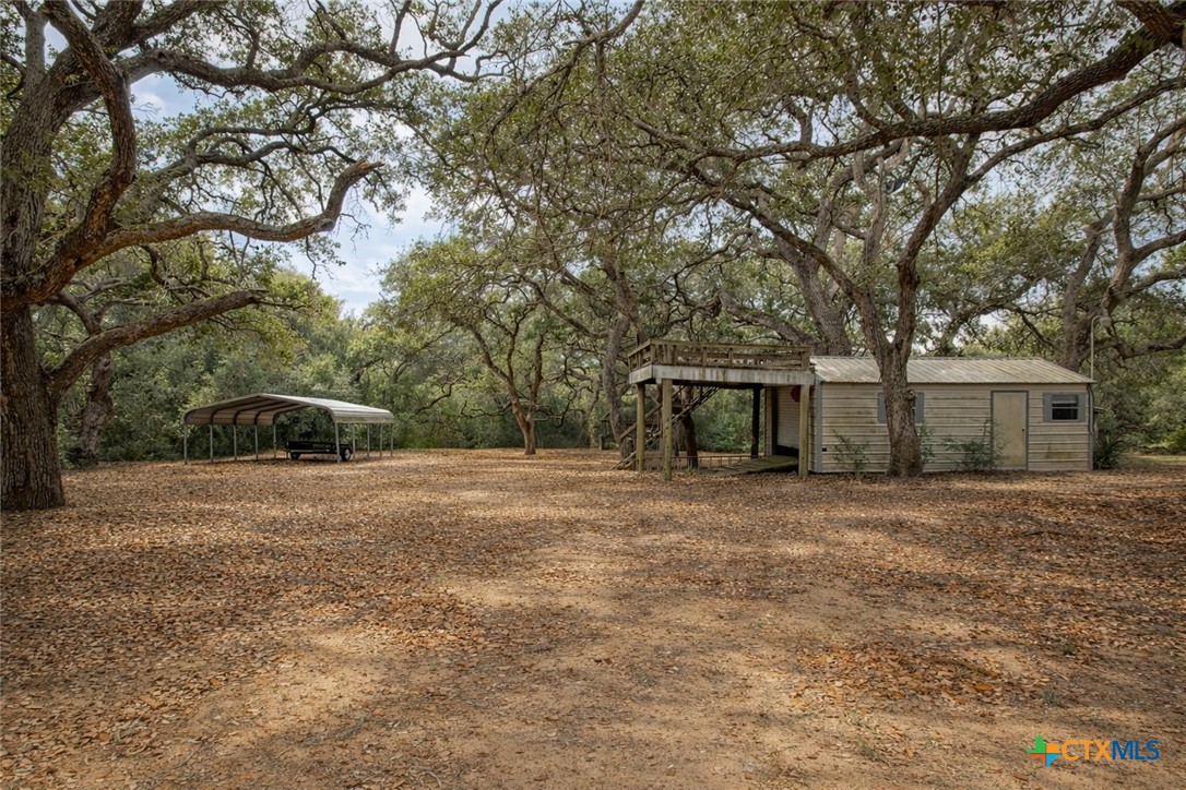 73 Rose Way North Victoria, TX 77905 - Photo 42 of 44 a front view of a house with a yard and trees