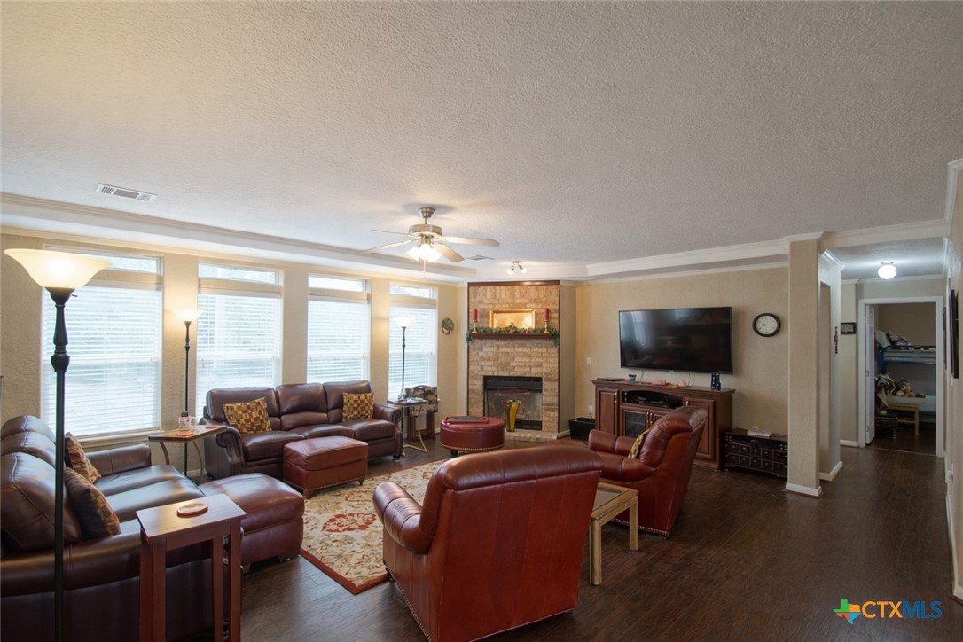 73 Rose Way North Victoria, TX 77905 - Photo 6 of 44 a living room with furniture a flat screen tv and a large window
