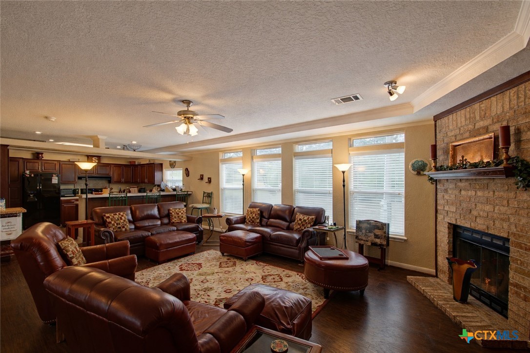 73 Rose Way North Victoria, TX 77905 - Photo 7 of 44 a living room with furniture fireplace and a large window