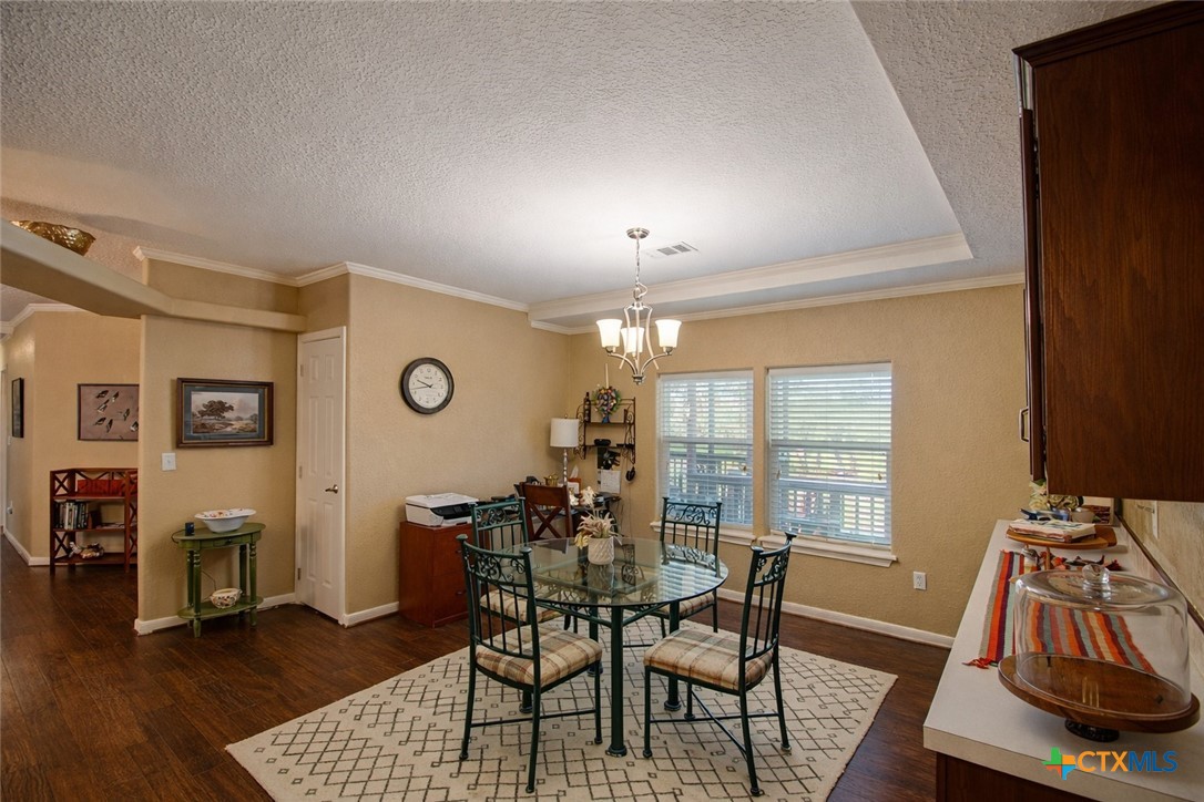 73 Rose Way North Victoria, TX 77905 - Photo 10 of 44 a view of a dining room with furniture and wooden floor