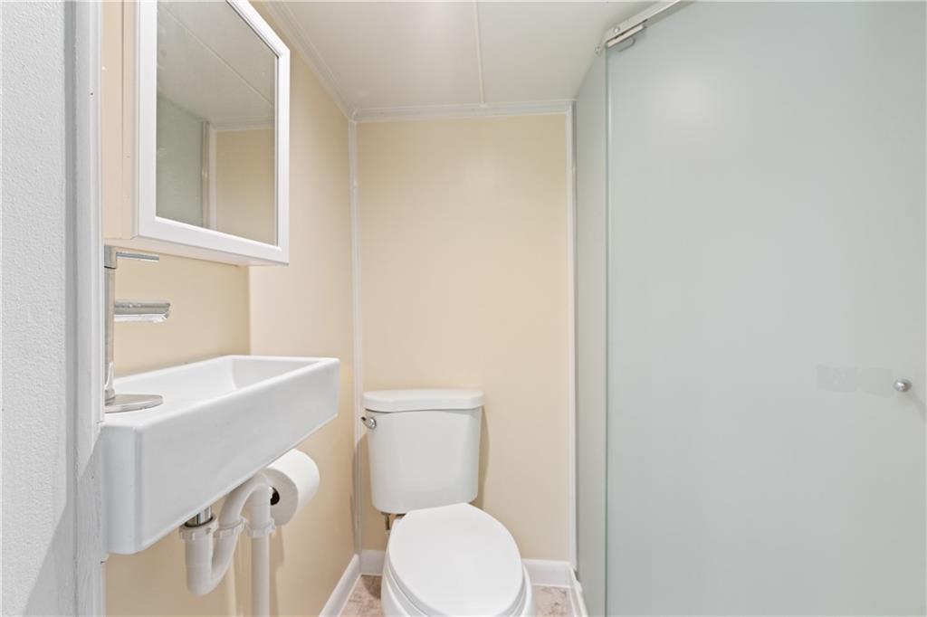 321 2nd Street Freeport, PA 16229 - Photo 12 of 24 a bathroom with a sink a toilet and vanity