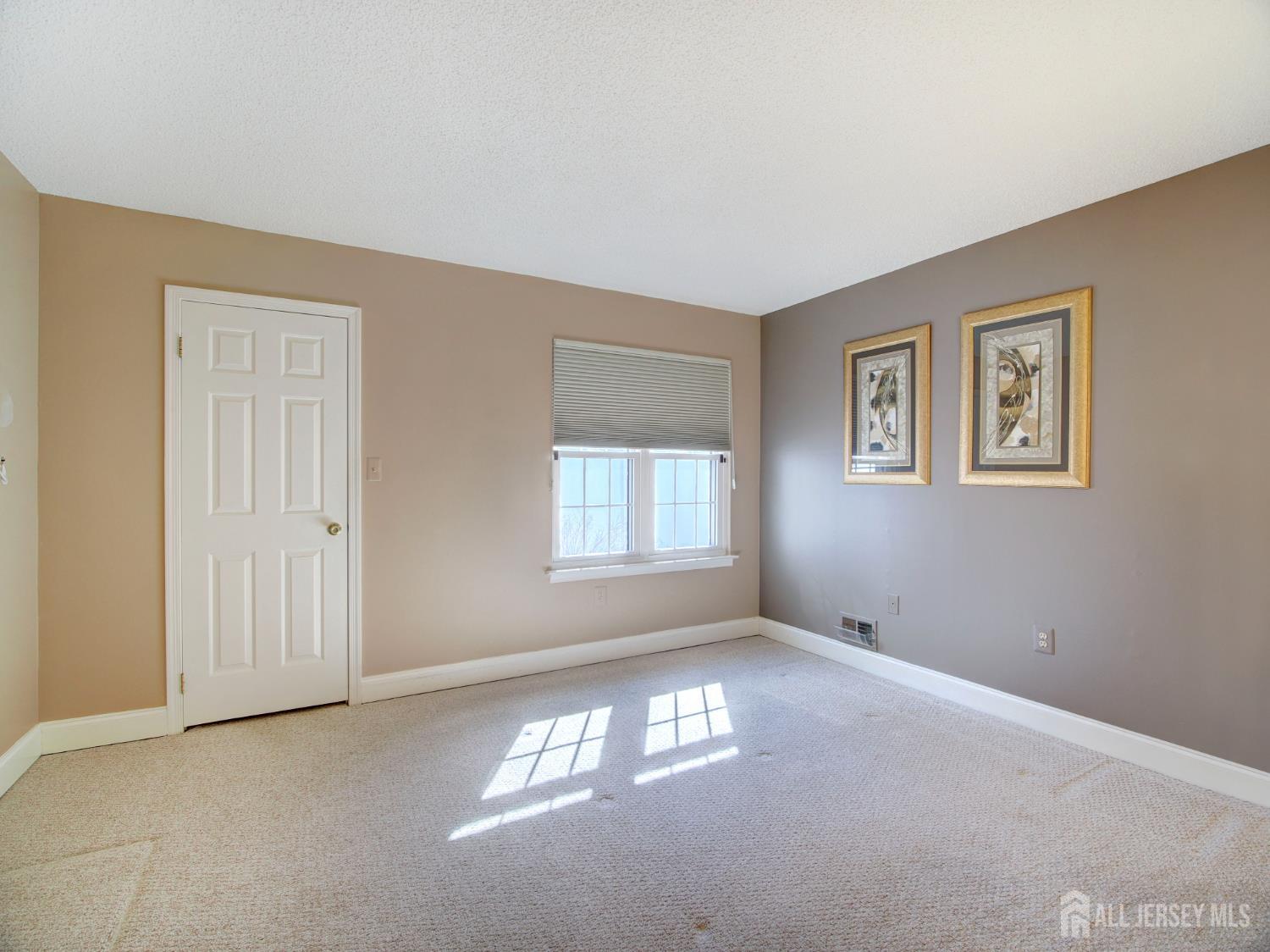 136 Wycoff Way West East Brunswick, NJ 08816 - Photo 12 of 28 a view of empty room with windows