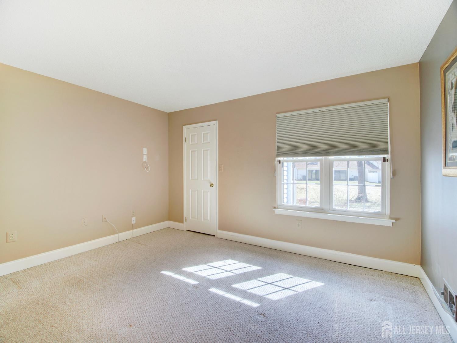 136 Wycoff Way West East Brunswick, NJ 08816 - Photo 13 of 28 an empty room with windows