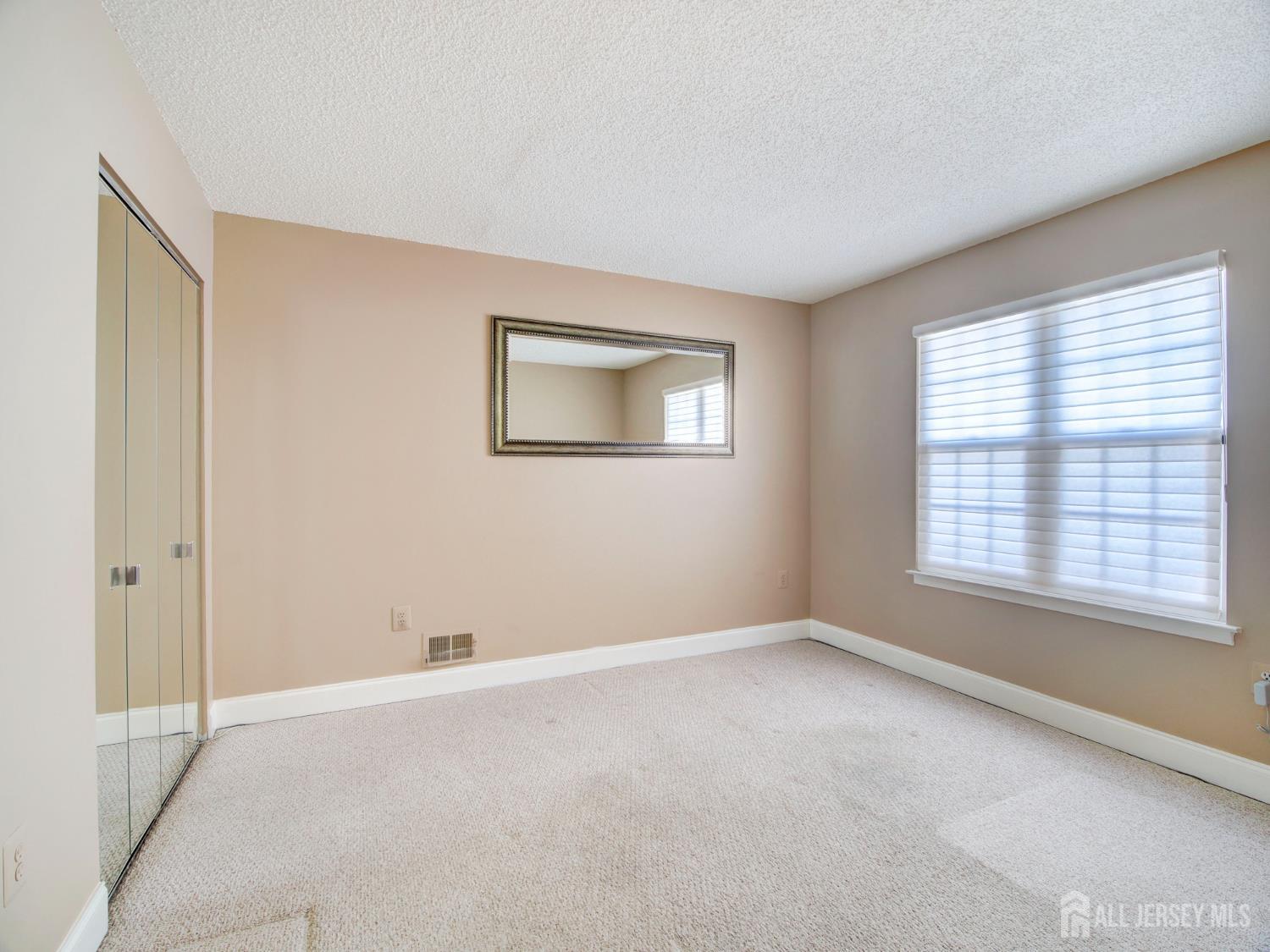 136 Wycoff Way West East Brunswick, NJ 08816 - Photo 15 of 28 a view of an empty room with a window