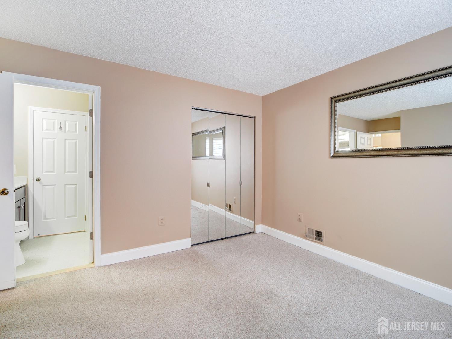 136 Wycoff Way West East Brunswick, NJ 08816 - Photo 16 of 28 an empty room with windows