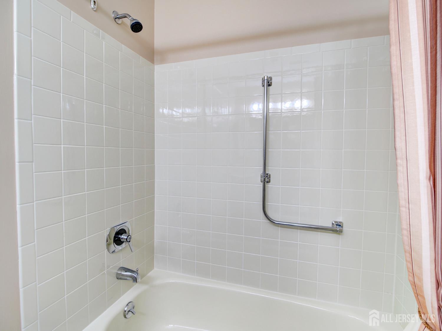 136 Wycoff Way West East Brunswick, NJ 08816 - Photo 19 of 28 a bathroom with a glass shower door