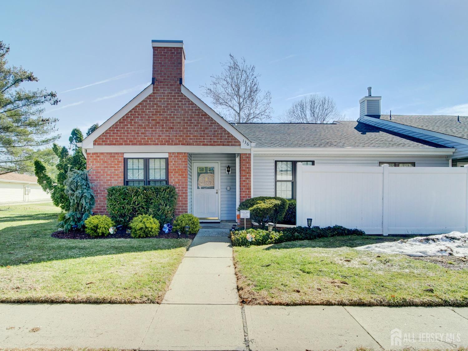 136 Wycoff Way West East Brunswick, NJ 08816 - Photo 2 of 28 a front view of a house with a yard