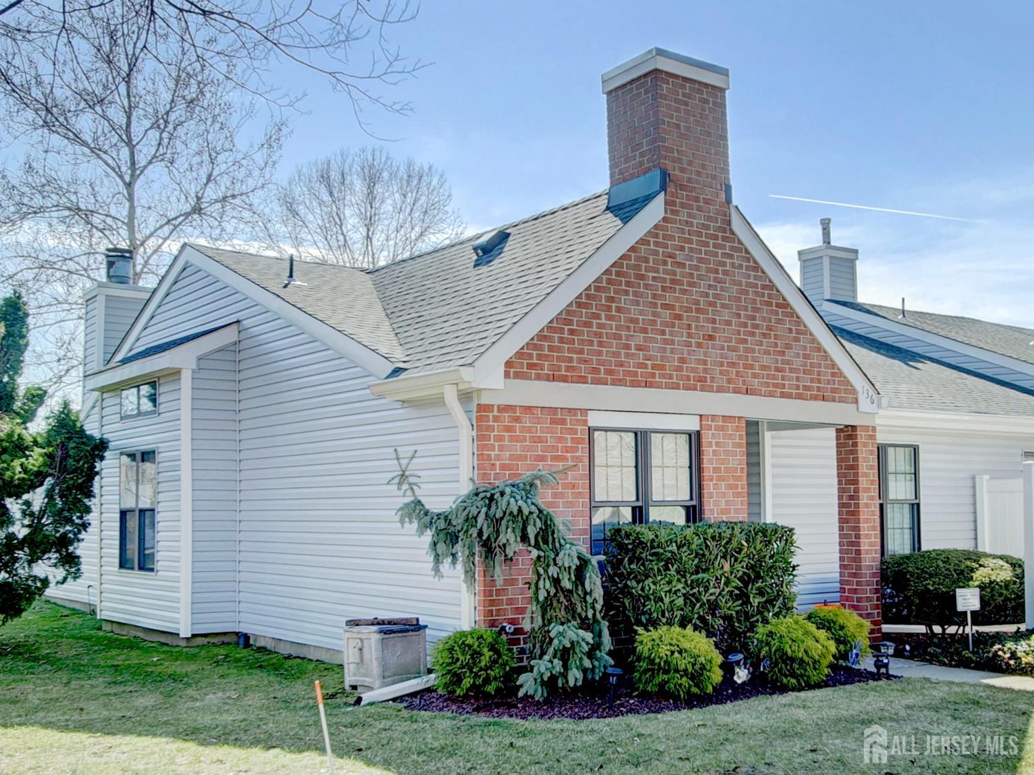 136 Wycoff Way West East Brunswick, NJ 08816 - Photo 22 of 28 a front view of a house with a yard and potted plants