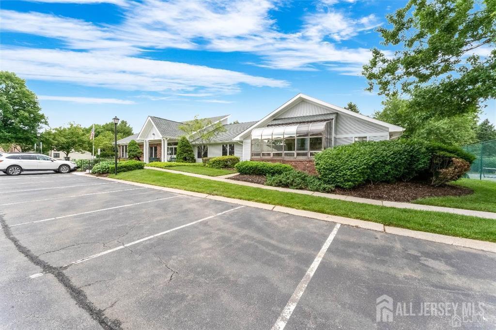 136 Wycoff Way West East Brunswick, NJ 08816 - Photo 26 of 28 a front view of a house with a yard