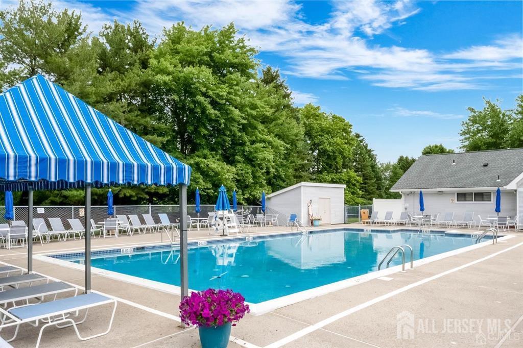 136 Wycoff Way West East Brunswick, NJ 08816 - Photo 27 of 28 a view of a swimming pool with a patio