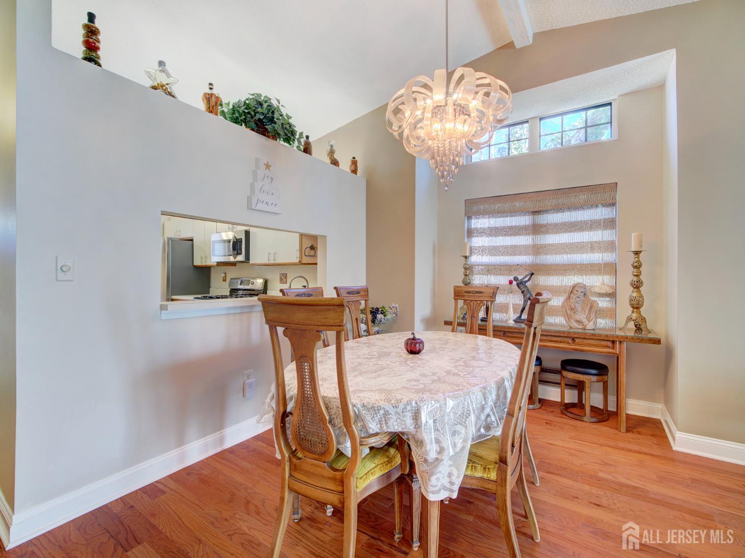 136 Wycoff Way West East Brunswick, NJ 08816 - Photo 6 of 28 a view of a dining room with furniture and wooden floor
