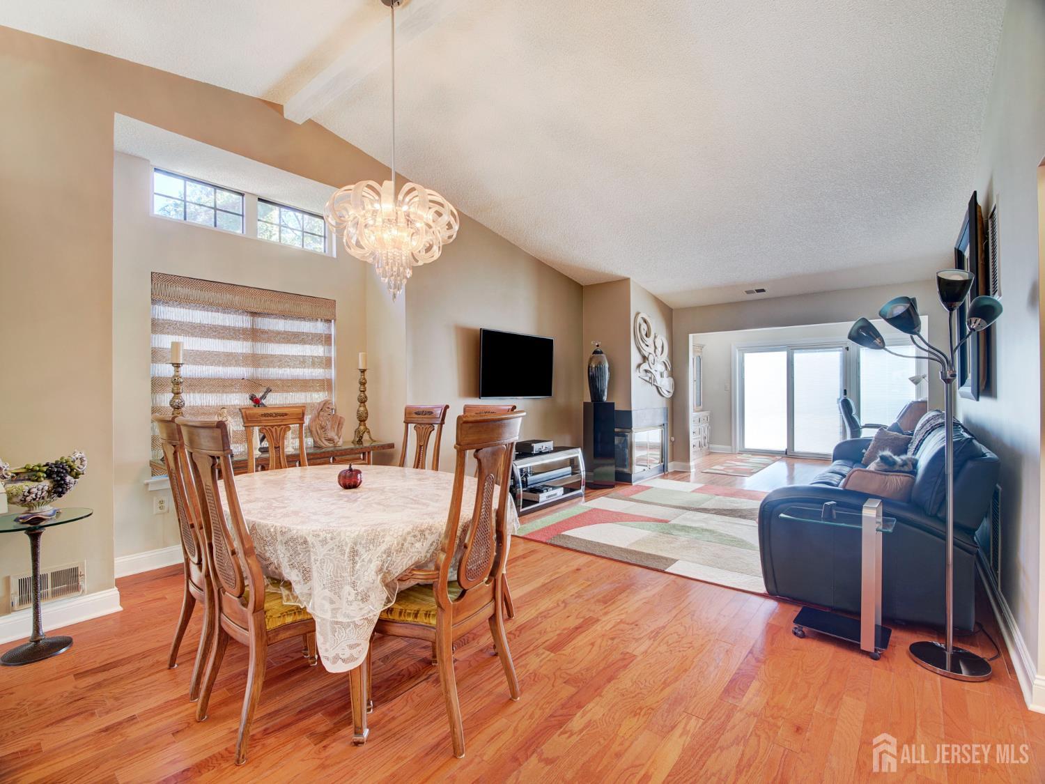 136 Wycoff Way West East Brunswick, NJ 08816 - Photo 7 of 28 a view of a dining room with furniture window and wooden floor