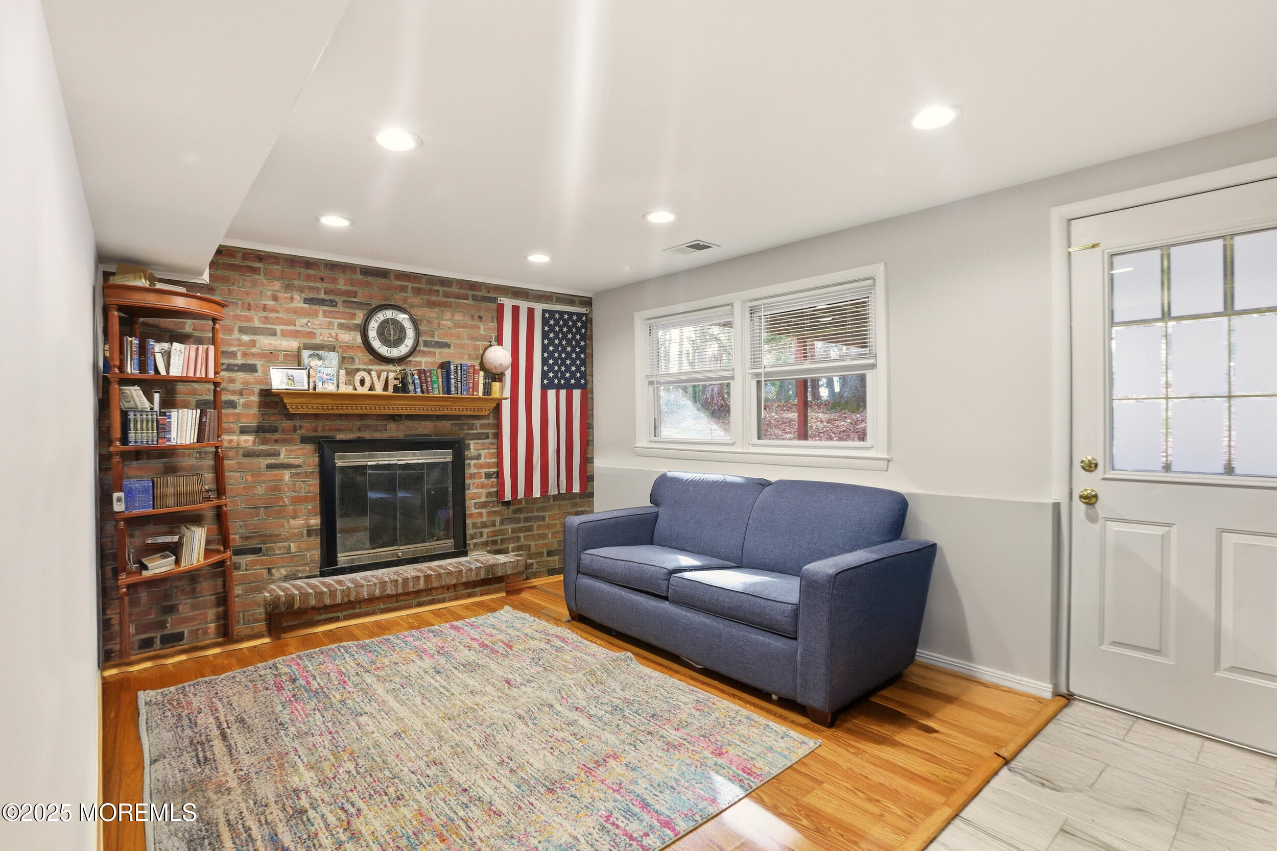 7 Citadel Court Jackson, NJ 08527 - Photo 20 of 29 a living room with furniture and a fireplace