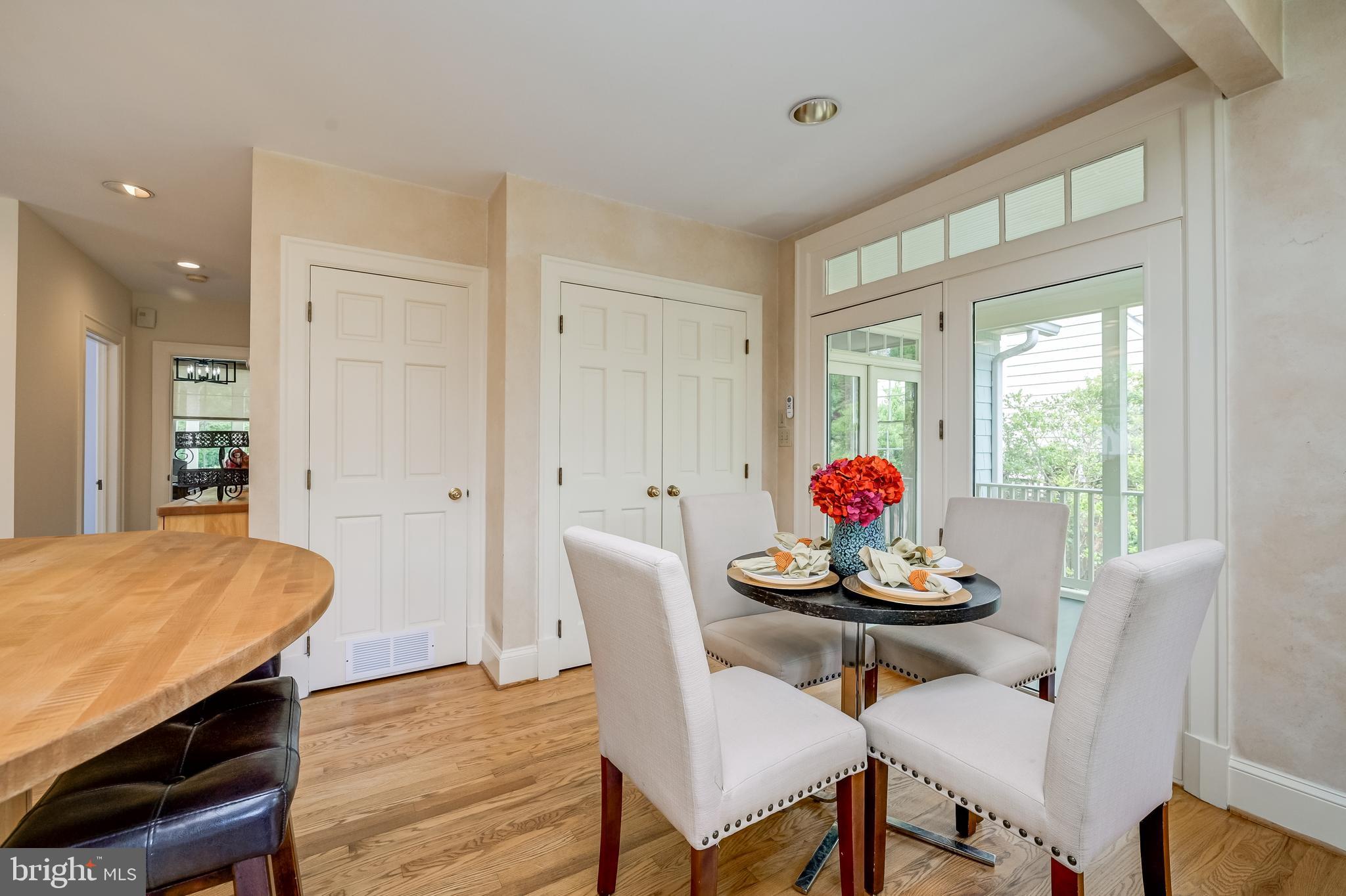 3608 Spring Street Chevy Chase, MD 20815 - Photo 19 of 38 a view of a dining room with furniture wooden floor and a window