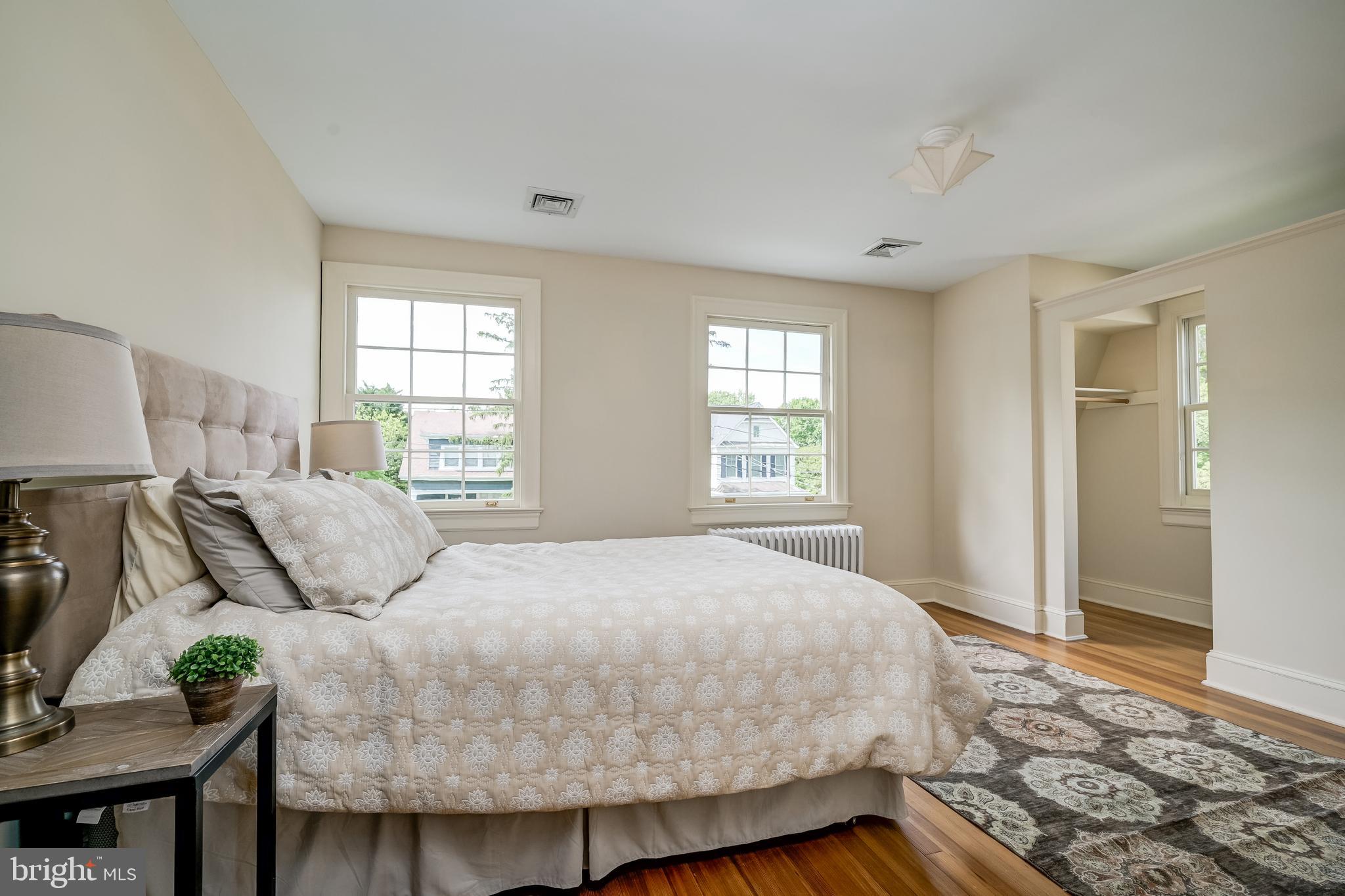 3608 Spring Street Chevy Chase, MD 20815 - Photo 24 of 38 a bedroom with a bed and window